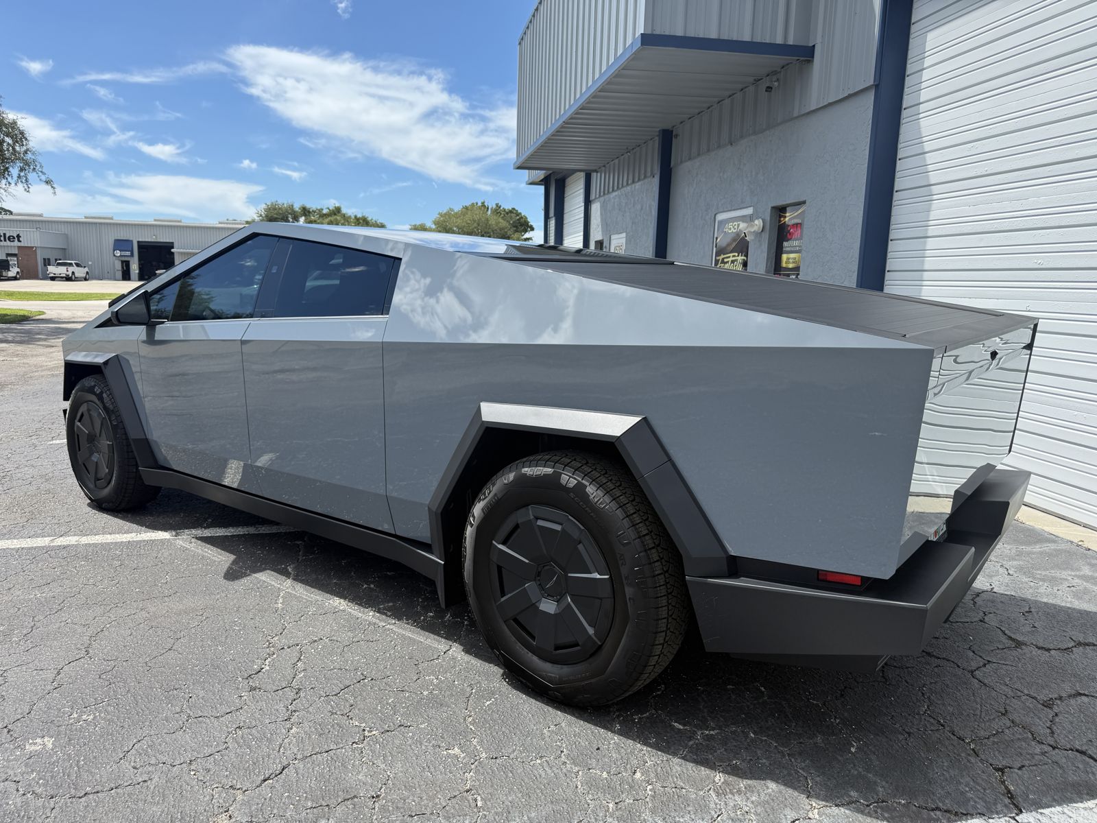 Side profile of Daniel's grey-wrapped 2026 Cybertruck
